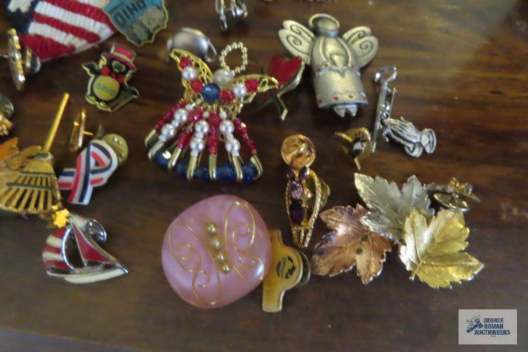 large assortment of pins, earrings,...keychain