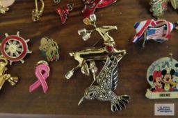 large assortment of pins, earrings,...keychain