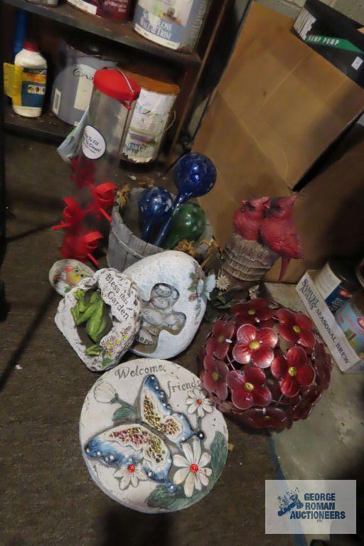 lot of yard decorations, bird feeders, and watering bulbs