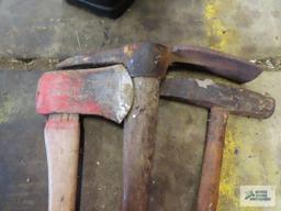 Lot of hand tools including axe, pick, and maul