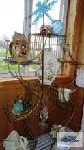 metal plant stand with assorted decorative items