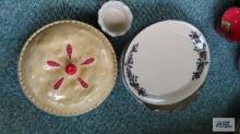 Cherry covered pie plates and decorative platters and bowl