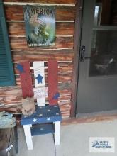 Grandchildren spoiled here red white and blue wood stool and America tin sign