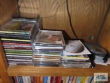 Lot of assorted CDs and CD player