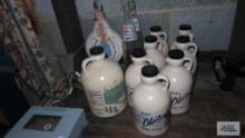 Ohio pure maple syrup plastic jugs, two Pepsi bottles, and Beam decanter