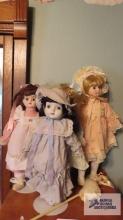 Four porcelain dolls