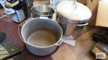 Large stainless steel pot. Heavy duty cast iron kettle. Other kitchen items