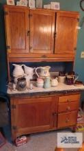 Oak Hoosier cabinet with porcelain shelves