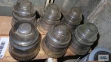 Six vintage clear glass insulators