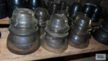 Six vintage clear glass insulators