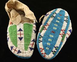 Pair of early Sinew sewn beaded