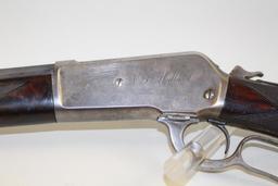 1886 Winchester deluxe rifle with factory engraved name “N.L. Milland”