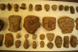 Framed Set of 53 Pre-Columbian Pottery Heads Recovered in Mexico. Largest is 4" x 1 3/4".