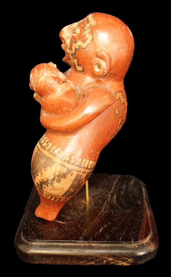 8 3/4" x 6" Chupicuaro figure of a mother holding a child with ornate geometric artwork. Mexico.