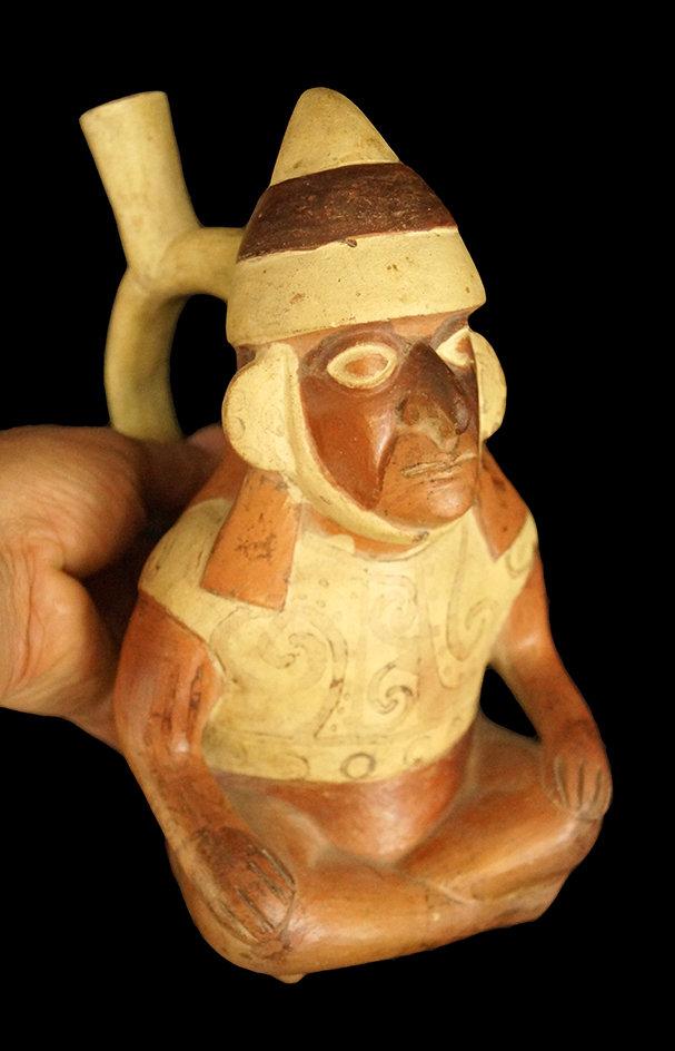 9" x 5" Moche Stirrup Bottle of a seated dignitary that is highly detailed, well crafted - Peru.