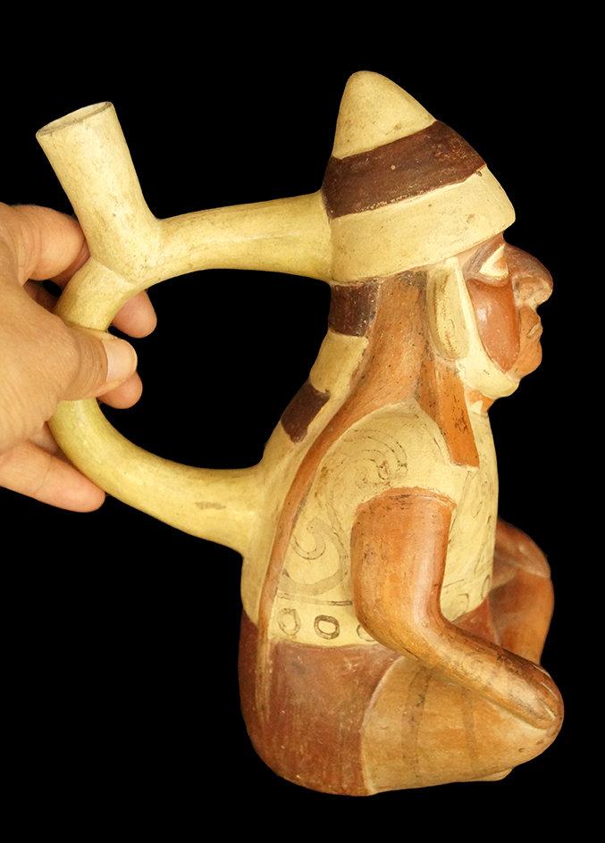 9" x 5" Moche Stirrup Bottle of a seated dignitary that is highly detailed, well crafted - Peru.