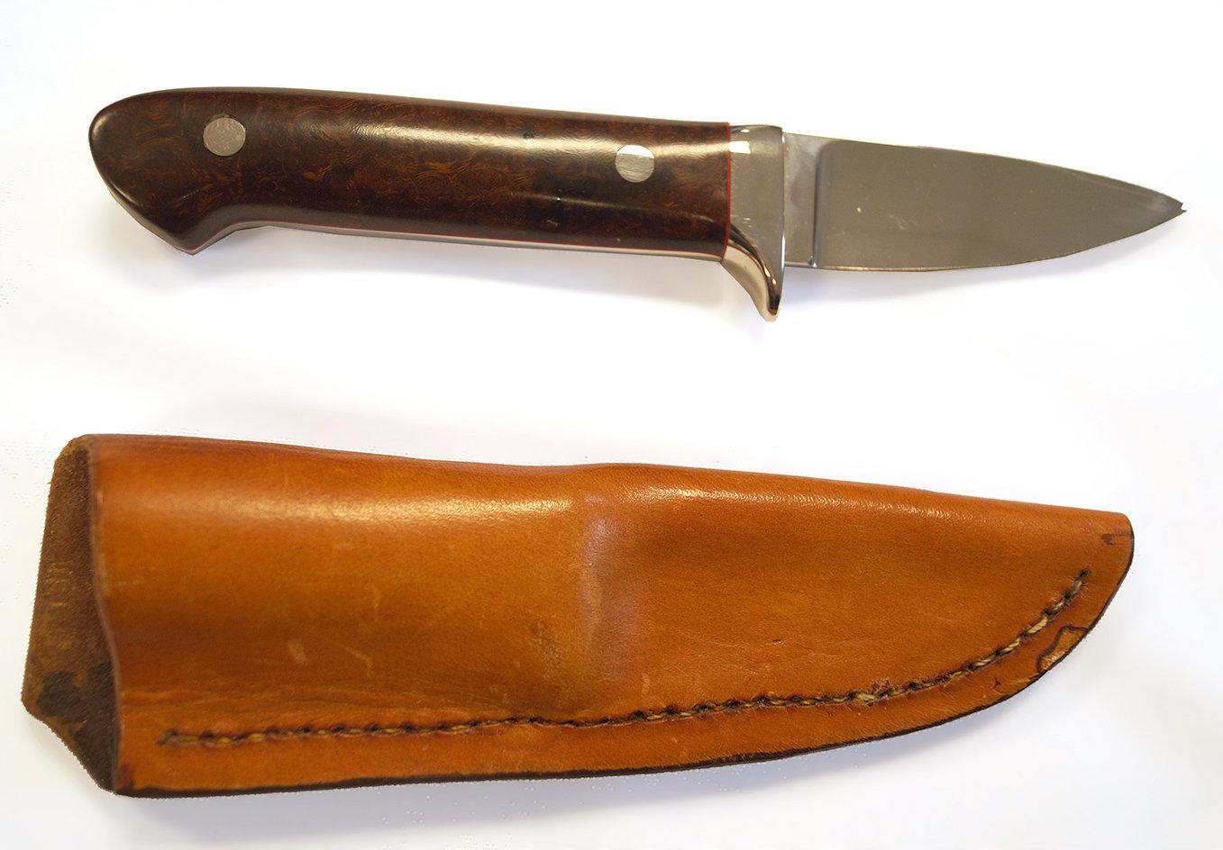 Knife made by Gary Smith Lynchburg, Ohio.  Blade is 3", overall is 7 1/2". Leather sheath included.