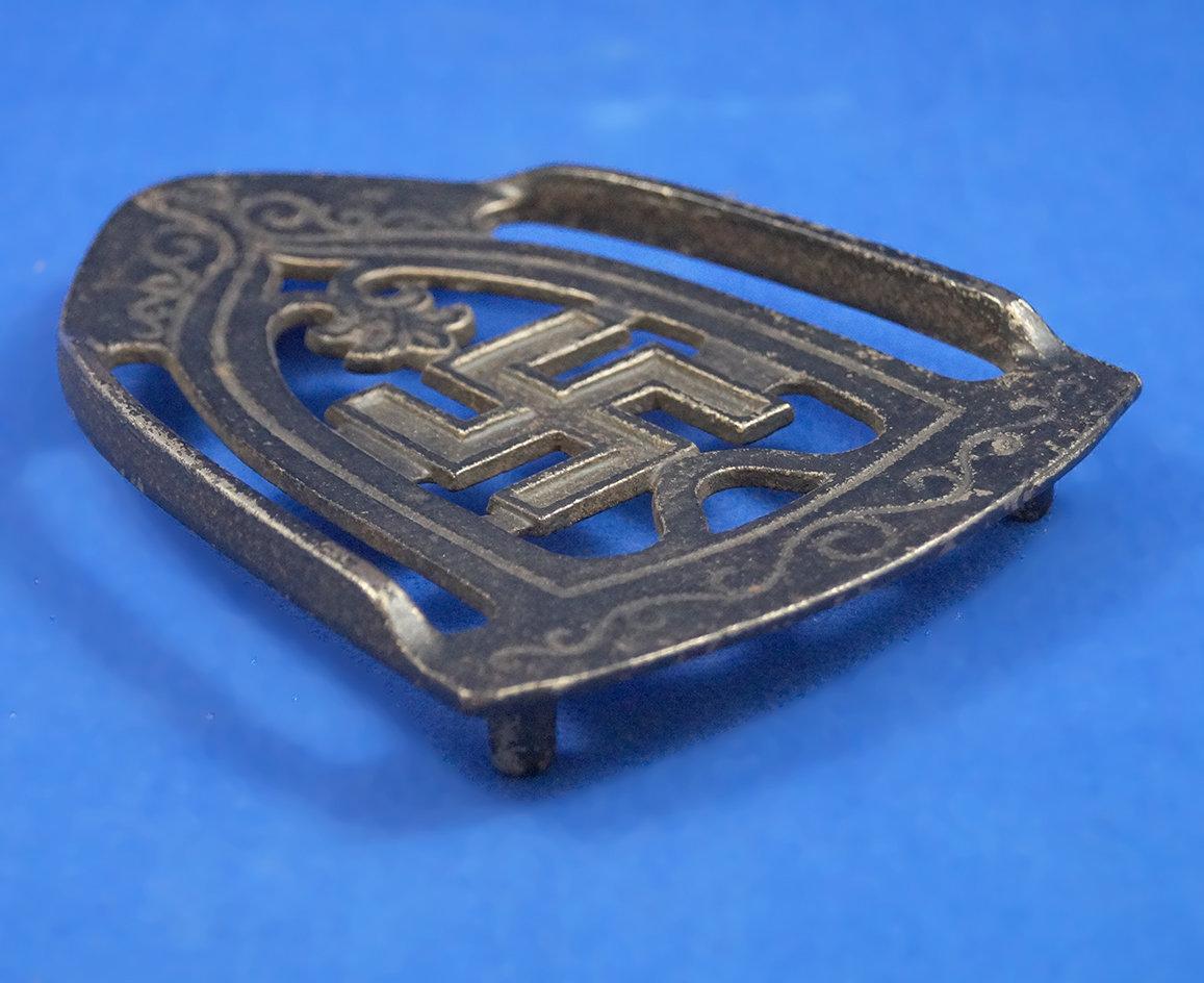 "Swastika" trivet, Buffin Tool Co, Louisiana, Missouri, early 1900's, 5 1/2" long