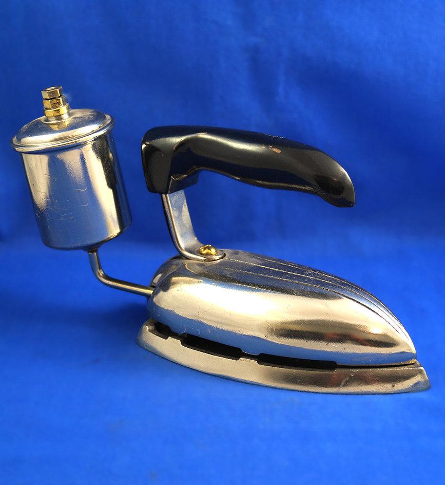 Royal petro iron, art deco styling, black handle, Ht 5 1/2", 7 1/4" long