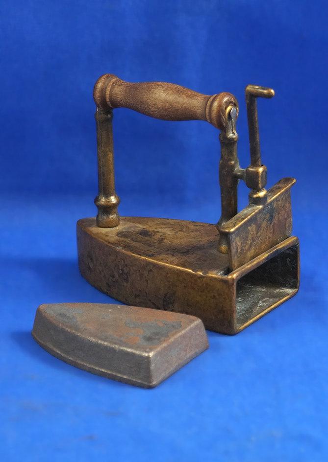 Box iron with slug,  lift gate, Wood handle, Ht 3 1/2", 3 3/4" long