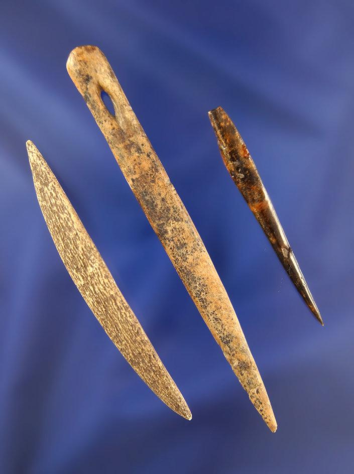 Set of three bone artifacts including a 4" Bone Needle, from the Bill Peterson Collection.