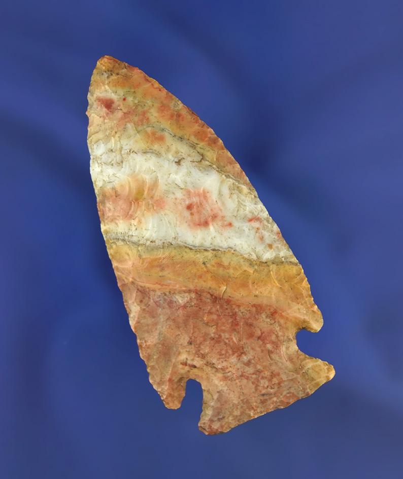 2 7/8" Flint Ridge Flint Archaic Cornernotch that is very colorful found in Ohio. Bennett COA.