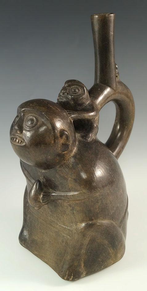 9 3/4" by 7" Chimu monkey effigy stirrup bottle from Peru. Deaccessioned Museum Artifact!