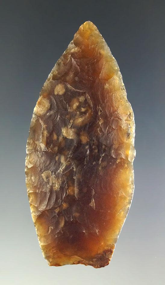 2 7/16" Agate Basin with heavily ground lower edges made from semi translucent Knife River.
