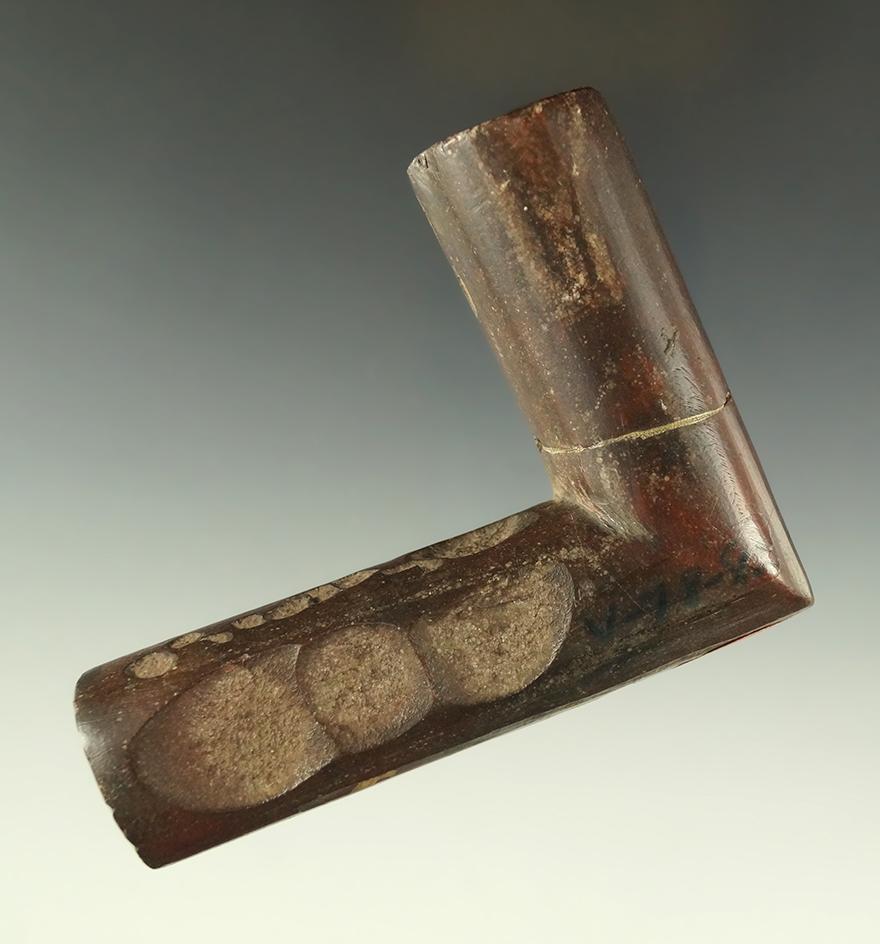 3 1/2" stone pipe which was in a fire which caused pock marks on the surface - Pennsylvania.