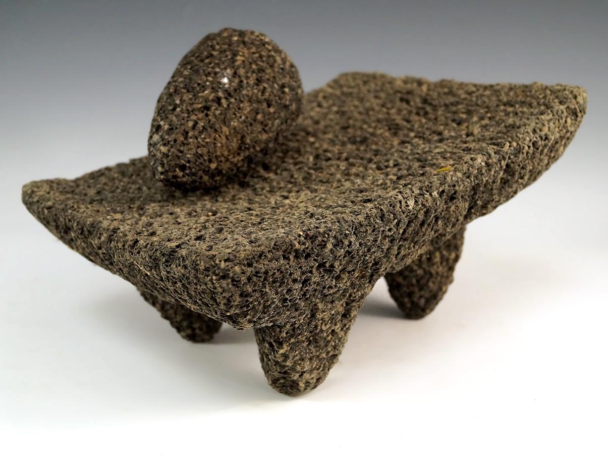 8 1/4" by 4 1/8" Tall Tri-leg Matate with grinding stone made from Lava Rock, found in Mexico.