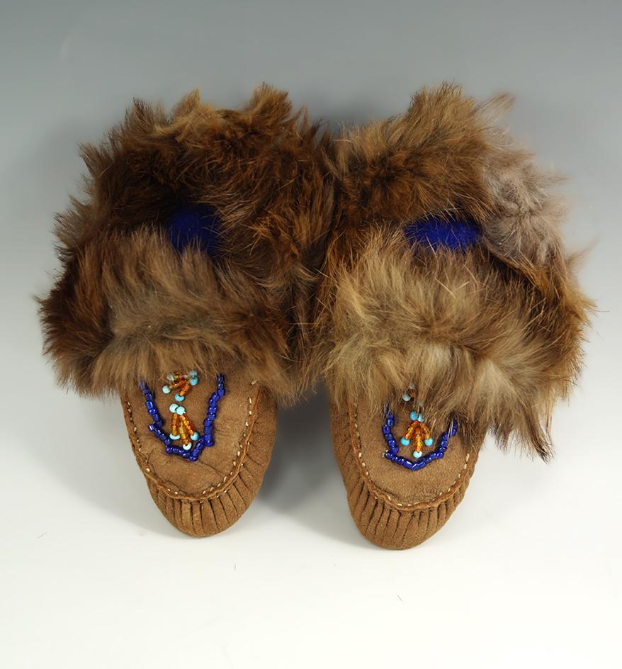 Contemporary Native American small childrens partially beaded Moccasins with dyed rabbit cuffs.