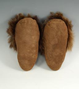 Contemporary Native American small childrens partially beaded Moccasins with dyed rabbit cuffs.