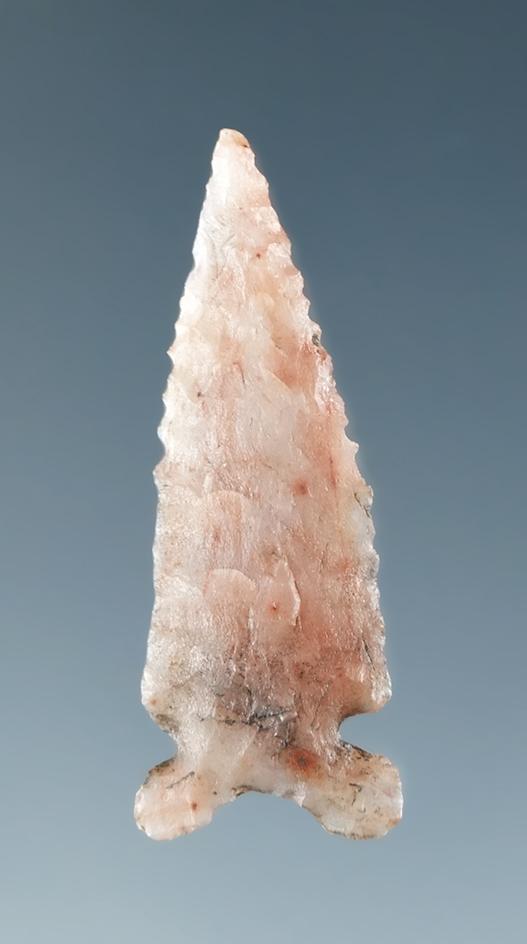 1 1/16" Arrowhead made from mottled pink and cream material, found in California.