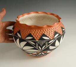 5 1/4" Tall contemporary Southwest style pottery jar that makes a nice display item.