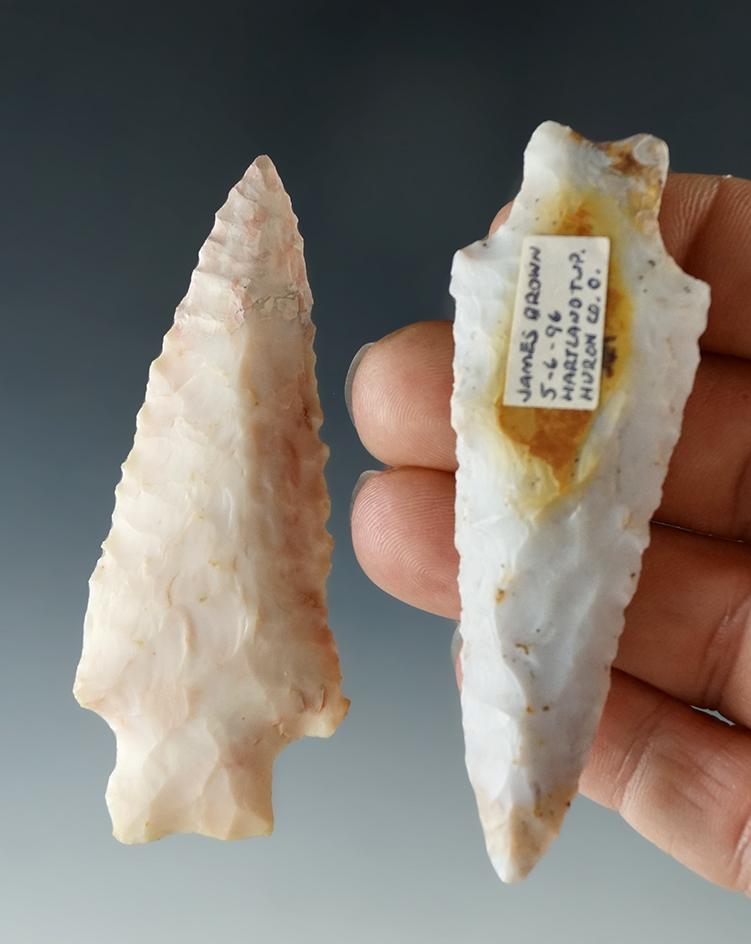 2 restored Flint Ridge Flint points, one has restoration to the tip area, the other to basal corner.