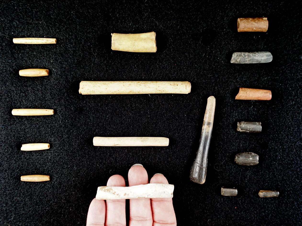 Nice framed group! 17 bone artifacts found a site in Tennessee including beads and a flaking tool