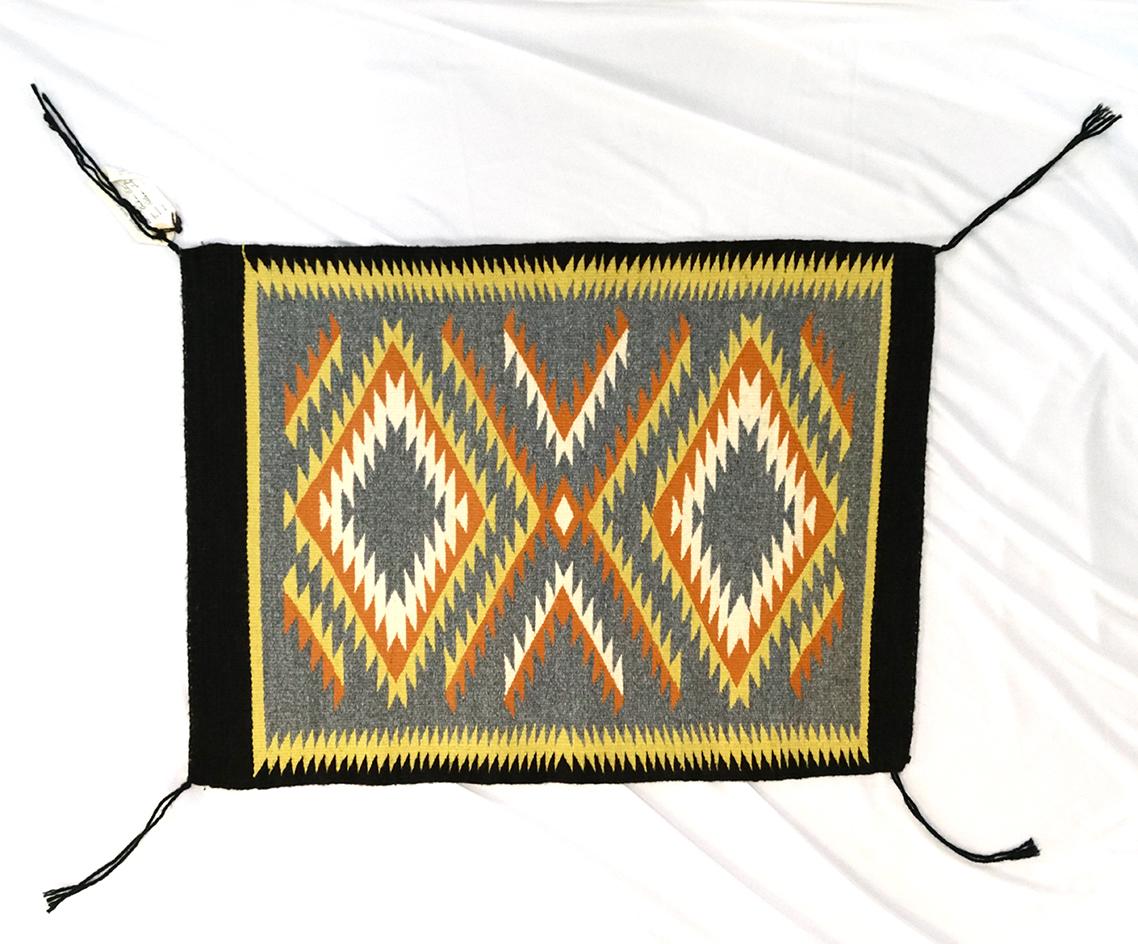 18" by 24.5" genuine Navajo Indian rug made from 100% virgin wool.