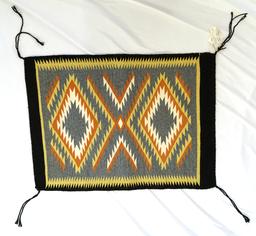 18" by 24.5" genuine Navajo Indian rug made from 100% virgin wool.