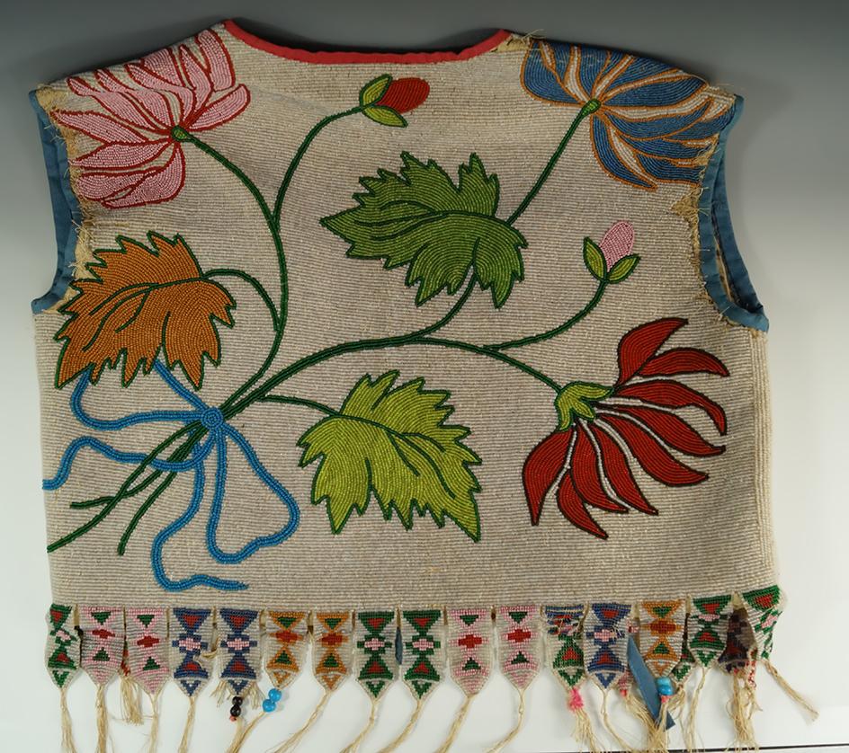 Anishinaabe Beaded Vest from the eary 1900's. Some wear and missing beads at shoulder areas.