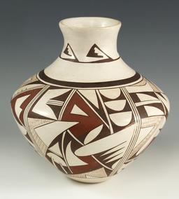 8" tall contemporary Acoma Pottery Vessel in excellent condition with beautiful artwork.