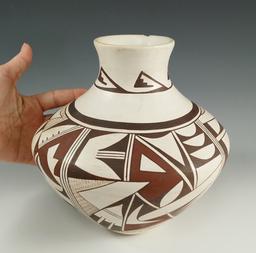 8" tall contemporary Acoma Pottery Vessel in excellent condition with beautiful artwork.