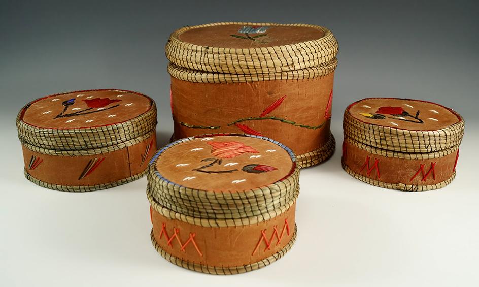 Set of four Birch bark lided Baskets with nice quill work. Largest is 6 1/2" diameter x 5" tall.