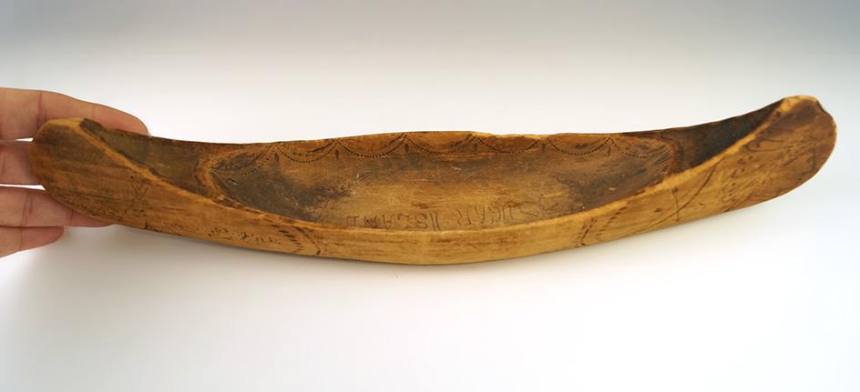 Vintage 13" long handcarved and nicely decorated wooden canoe from sugar Island, Michigan.