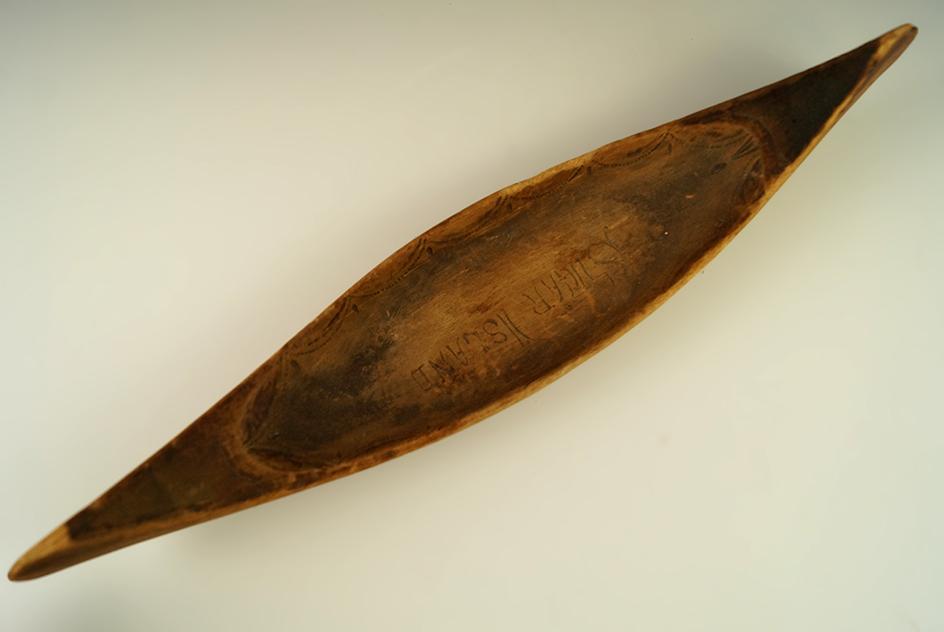 Vintage 13" long handcarved and nicely decorated wooden canoe from sugar Island, Michigan.