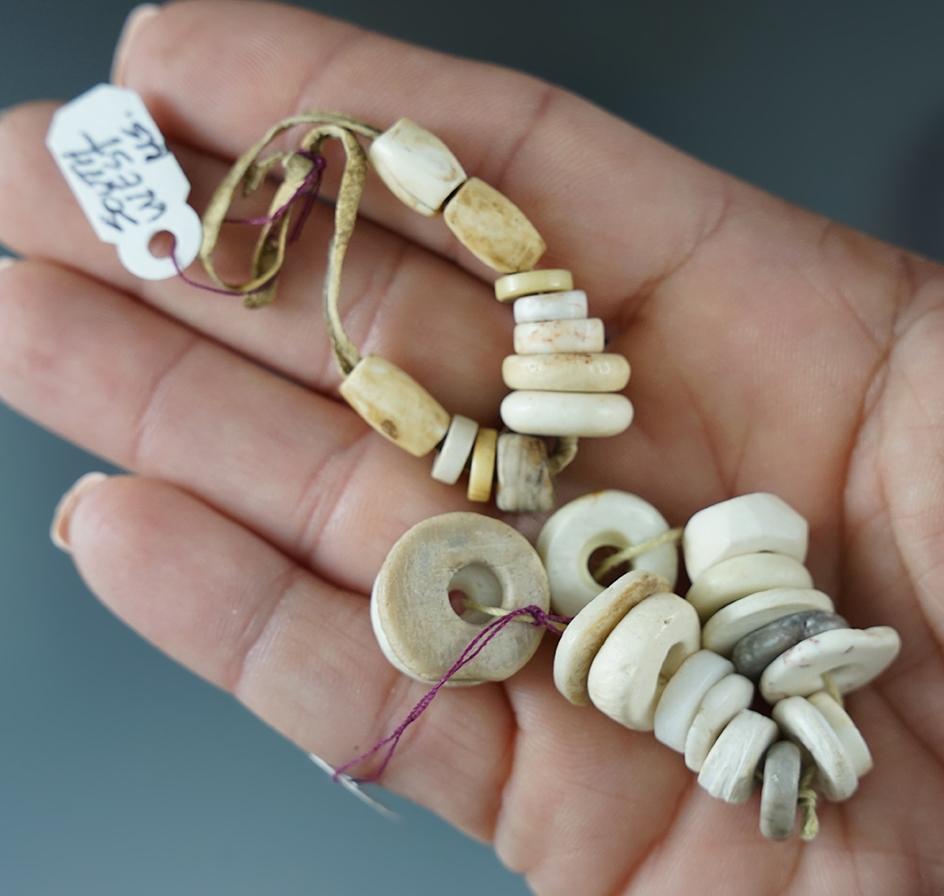 Two strands of Southwestern drilled stone, shell and bone beads.
