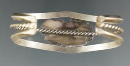 Contemporary Southwestern bracelet that is 2 5/8" wide.