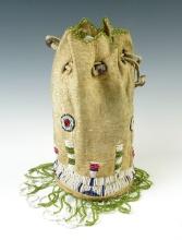Nice vintage drawstring leather bag that is 8" tall x 4" wide. Beadwork is in very nice condition.