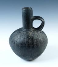 7 5/8" tall by 5 3/8" wide Blackware Pre-Columbian Strap Handled Bottle. Ex. Rob Dills.