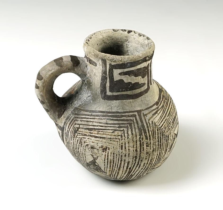 2 3/4" tall x 3" wide Miniature Anasazi Handled Pitcher with some restoration to handle area.