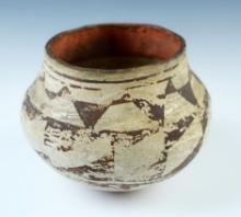 5" wide x 4 1/2" tall Acoma Polychrome Jar with a dimpled base. Ex Russell E. Morris. COA.